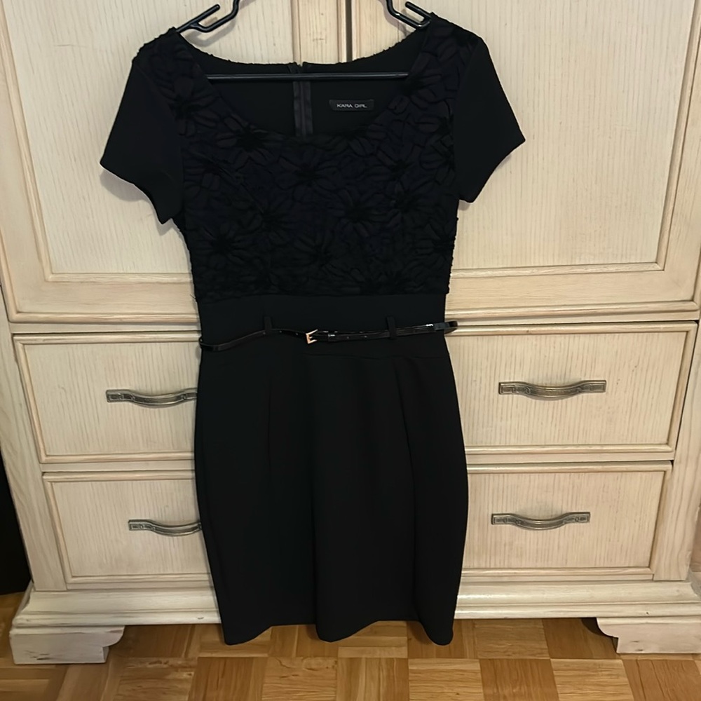 Belted black  dress with lace on top.